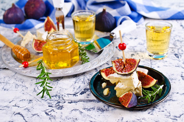 Pieces of Camembert and figs