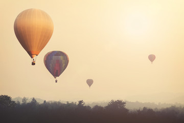 Vintage hot air balloon flying on sky with fog. photo vintage of travel and air transportation -vintage with retro filter effect style