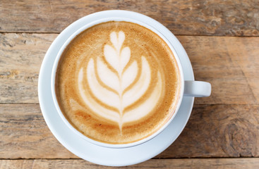 Cup of coffee latte art on wood table