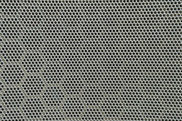 Closeup surface of black metal loudspeaker at the door of car textured background