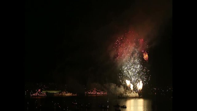 Fireworks in the bay with warships