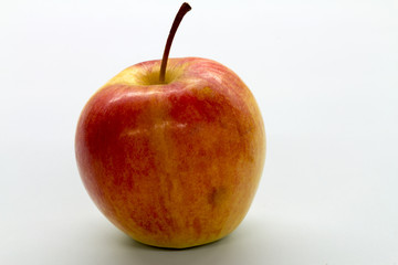 red apple on white table