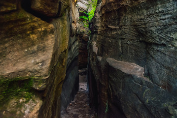 The passage between the rocks in the canyon crevice. Path like nature labirint, landscape