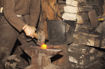 Blacksmith working in the forge 