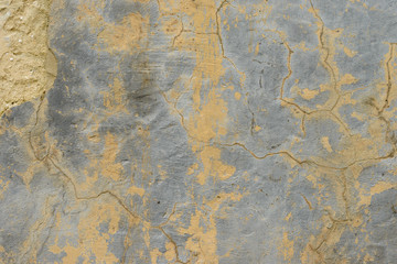 Wall fragment with scratches and cracks