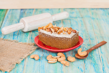 Coffee cake with cashew nut on wood table