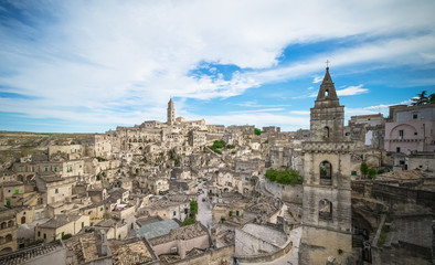 Fototapeta na wymiar panoramic view of typical stones (Sassi di Matera) and church of Matera