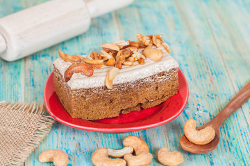 Coffee cake with cashew nut on wood table
