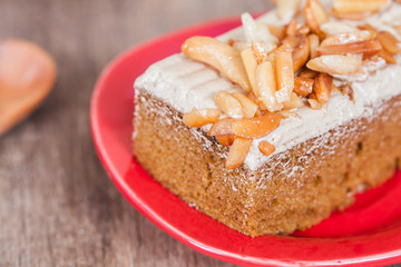 Coffee cake with cashew nut on wood table