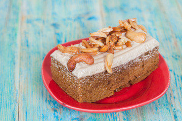 Coffee cake with cashew nut on wood table