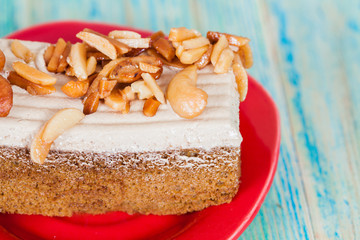 Coffee cake with cashew nut on wood table