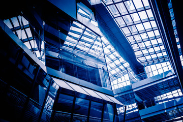 Fototapeta na wymiar Low Angle View Of Glass Roof of modern building in blue tone.