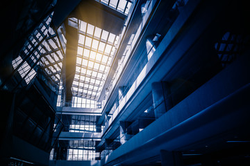 Low Angle View Of Glass Roof of modern building in blue tone.