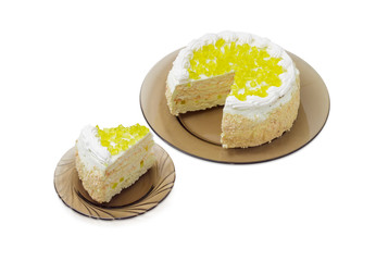 Layered cake with slices of lemon jelly on glass dishes