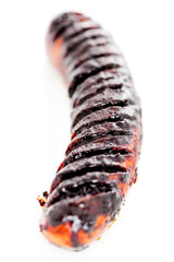 Baked sausage with soy sauce isolated on white background