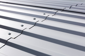 gray corrugated metal cladding on industrial building roof