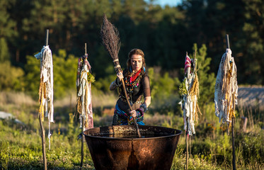 witch brew a potion in the big cauldron