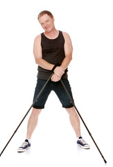 The man is engaged in Nordic walking