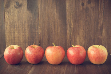 Apples on wooden rustic background