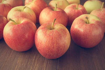 Fototapeta na wymiar Apples on wooden rustic background