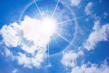Sun corona on blue sky.