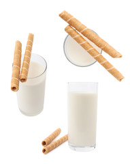 Glass of milk and wafel sticks isolated over the white background