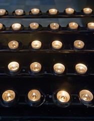 Candles lit in catholic temple