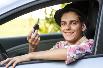 young man driving in the car