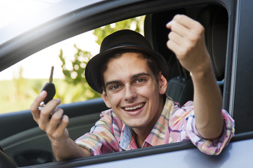 man holding car key