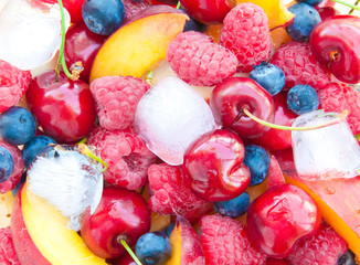 Fresh fruit salad in a glass bowl with ice