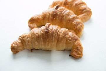 Croissant isolated on white background closeup
