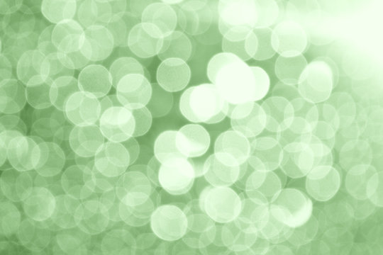 Abstract circular green bokeh background.