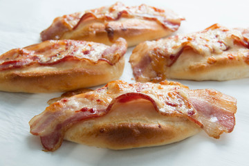  bacon and mozzarella  cheese on bread