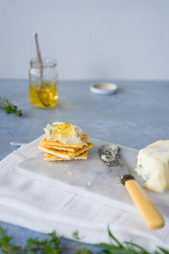 Crackers with gorgonzola and herb and white wine  jelly. Selective focus.