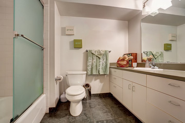 Classic American bathroom interior with white vanity cabinet