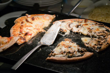 Hot pizza slice with melting cheese
