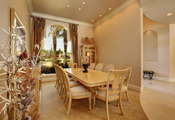 Luxury beige dining room interior with large window