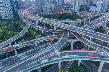High-angle view of Shanghai Highway with skyscrapers in background.