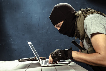 Terrorist working on his computer