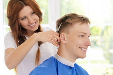 Fototapeta premium boy getting haircut 