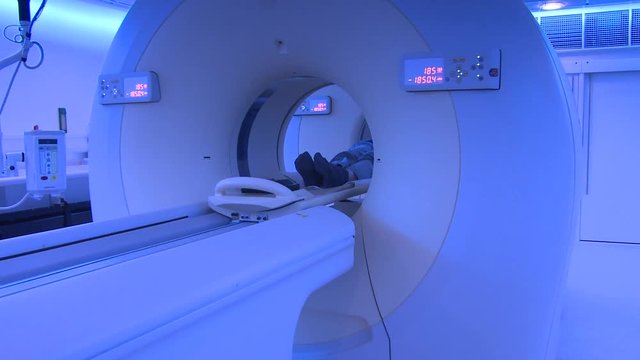 PET CT Scanner - camera tracks whilst patient is scanned. 