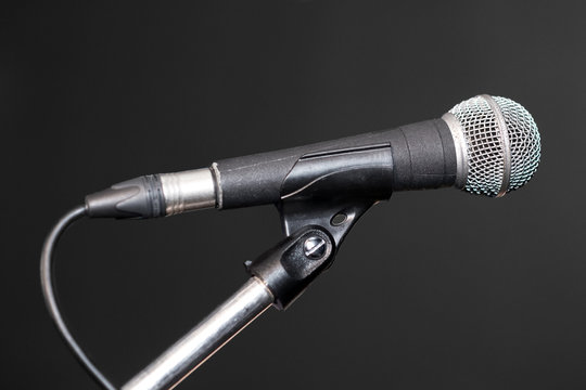 Microphone over grey background