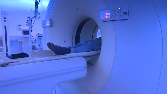 PET CT scanner. Camera tracks as anonymous patient is moved into scanner. 

(Filmed in ProRes with high dynamic range for flexibility for image grading)