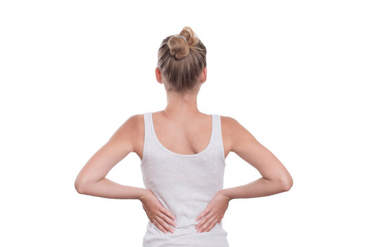 Woman with back pain, isolated on white background