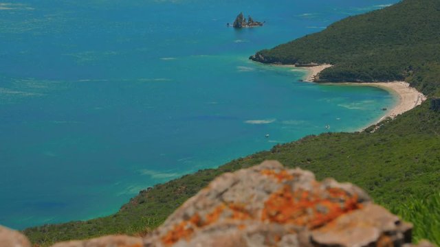 A jib shot revealing the beautiful Arr&aacute;bida Hill (Serra da Arr&aacute;bida) and beaches off the coast of Set&uacute;bal, Portugal
