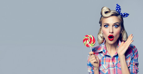 beautiful woman with lollipop, dressed in pin-up style