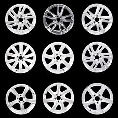 Set of 9 isolated car wheels on black background