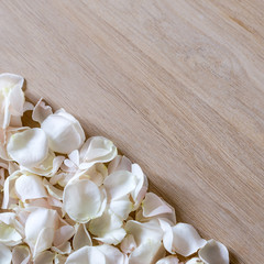 Creative arrangement made of different flowers on wooden background with space for text.