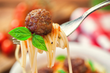 Spaghetti with meatball on a fork