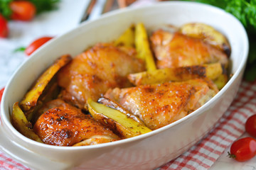 Baked, marinated chicken with potatoes and rosemary